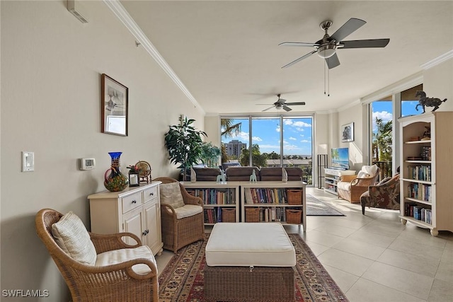 interior space with ceiling fan, crown molding, light tile patterned flooring, and a wall of windows