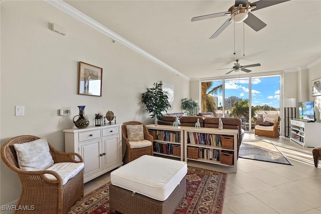 sitting room with ceiling fan, floor to ceiling windows, light tile patterned floors, and ornamental molding