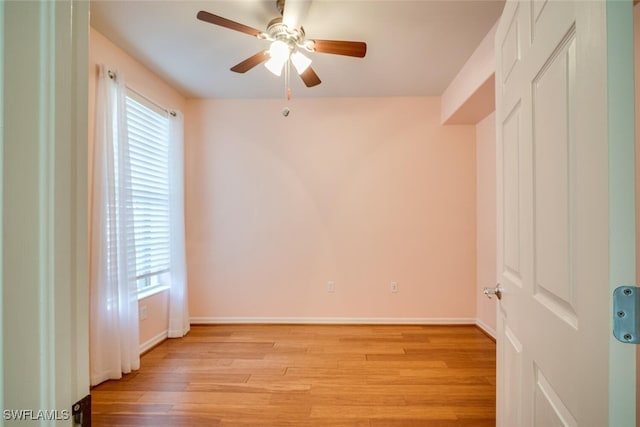 spare room featuring ceiling fan and light hardwood / wood-style flooring