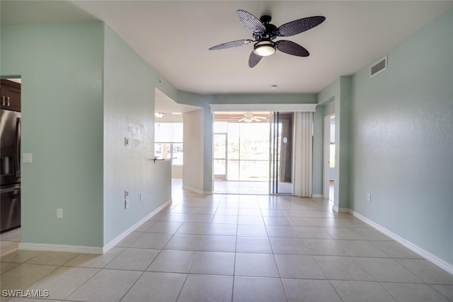 tiled empty room with ceiling fan