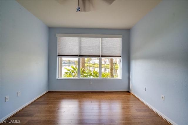 unfurnished room featuring hardwood / wood-style floors