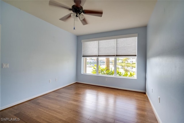 spare room with ceiling fan and light hardwood / wood-style flooring