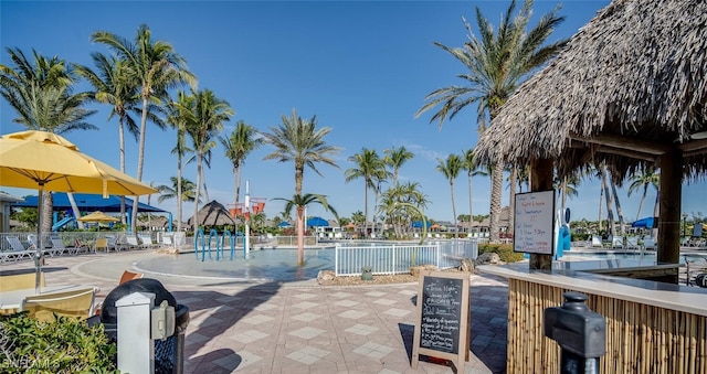 view of pool with a gazebo and pool water feature