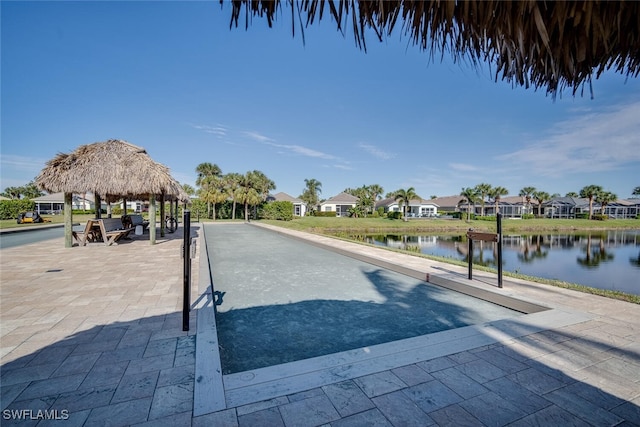 view of home's community with a gazebo and a water view