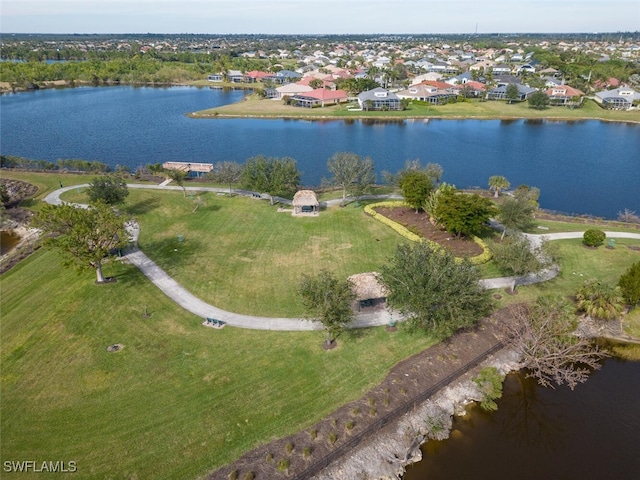 birds eye view of property with a water view