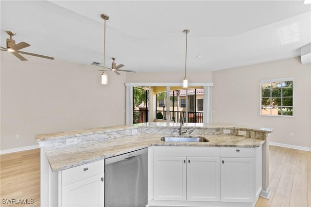 kitchen with white cabinets, stainless steel dishwasher, and sink