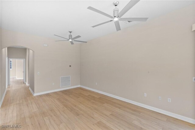 spare room with ceiling fan and light hardwood / wood-style floors