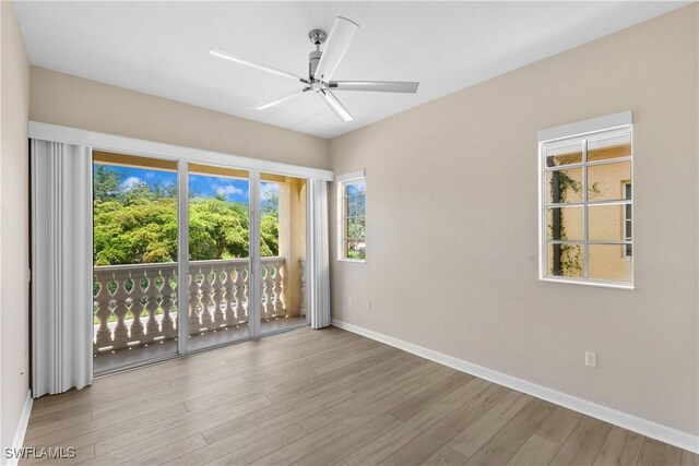 spare room with ceiling fan and wood-type flooring