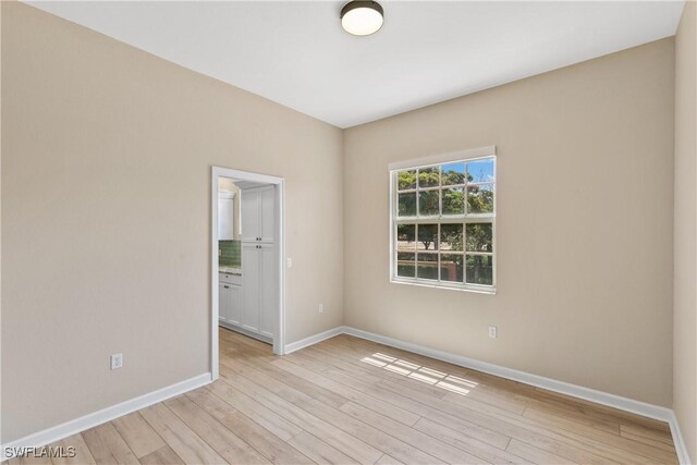 unfurnished room featuring light hardwood / wood-style floors