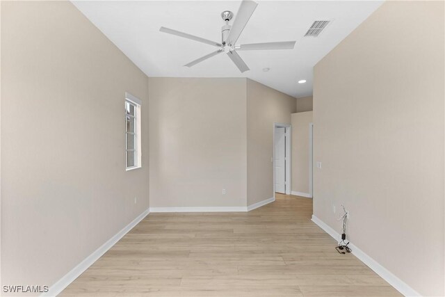 spare room featuring light wood-type flooring and ceiling fan