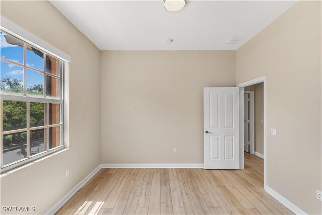 spare room with light hardwood / wood-style floors