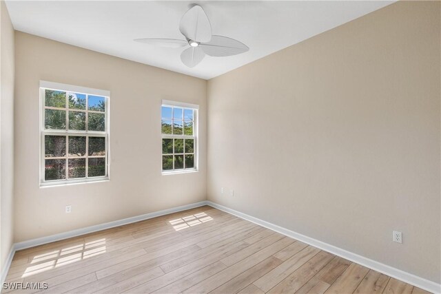 unfurnished room with ceiling fan and light hardwood / wood-style flooring