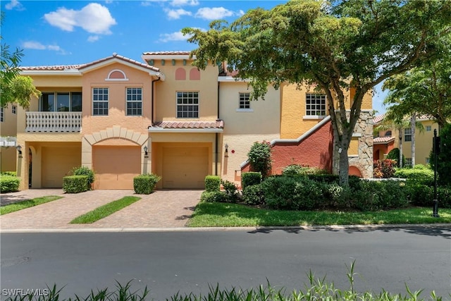 mediterranean / spanish-style house featuring a garage