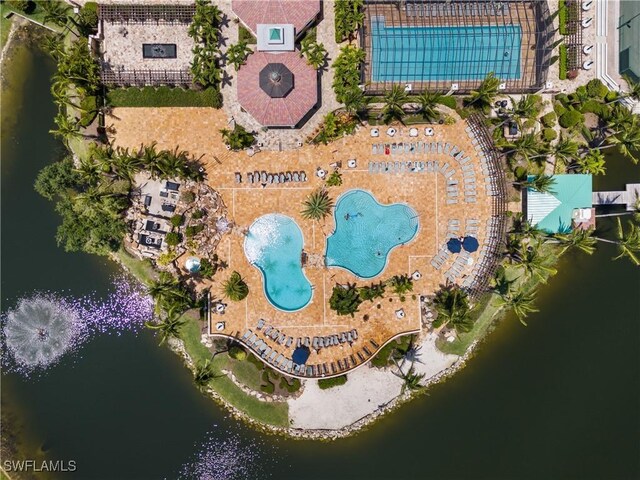 birds eye view of property with a water view