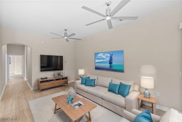 living room featuring ceiling fan and light wood-type flooring