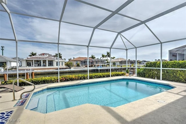 view of swimming pool featuring a lanai and a patio