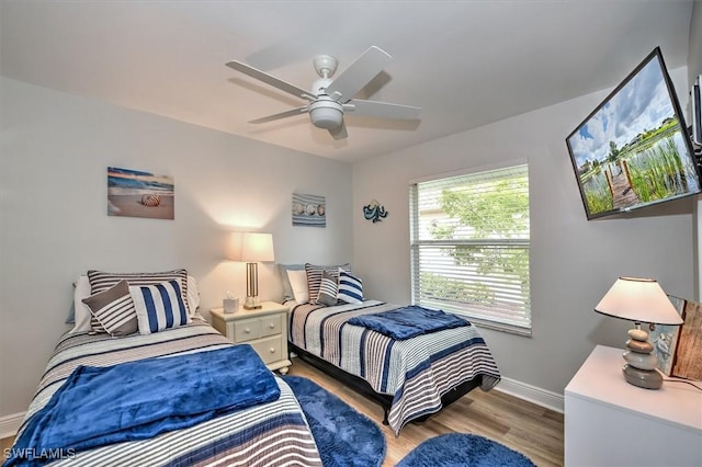 bedroom featuring ceiling fan and light hardwood / wood-style floors