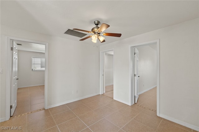 unfurnished room with ceiling fan