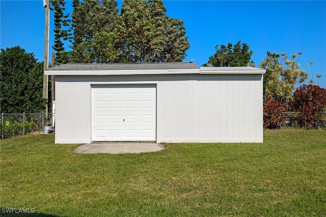 garage featuring a lawn