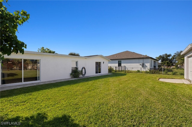 view of yard featuring a garage