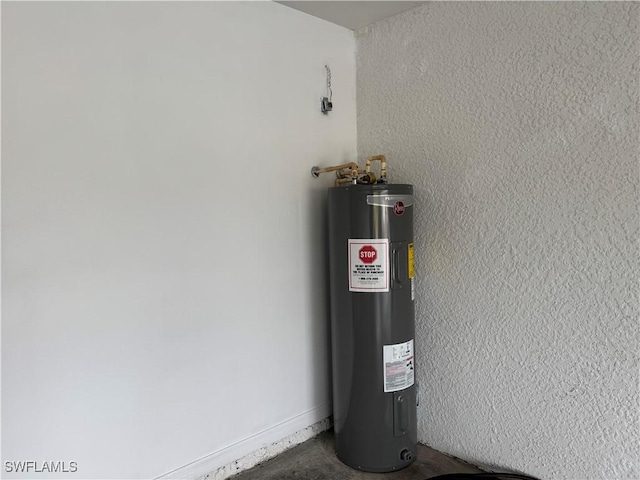 utility room featuring electric water heater