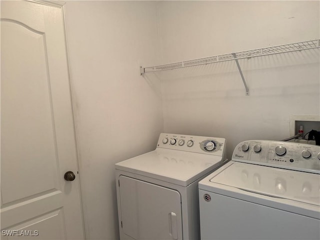 laundry room with separate washer and dryer