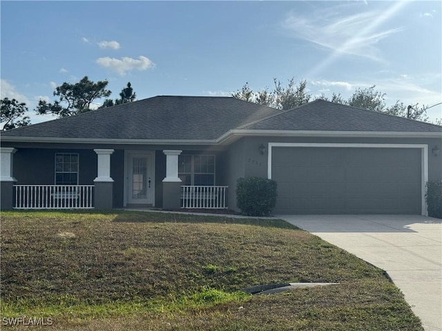 view of front facade featuring covered porch, a front lawn, and a garage