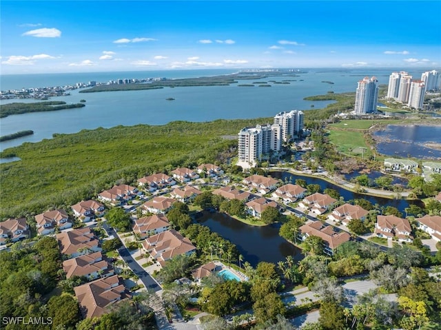 birds eye view of property featuring a water view