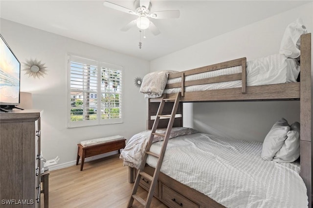 bedroom with light hardwood / wood-style floors and ceiling fan