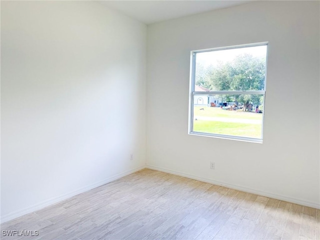 spare room featuring light hardwood / wood-style floors