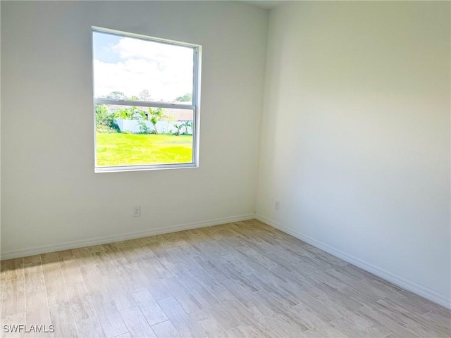 unfurnished room featuring light hardwood / wood-style flooring