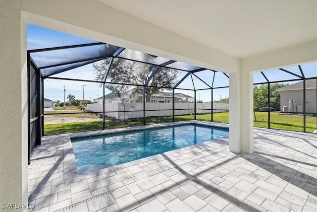 view of pool with a lanai, a yard, and a patio