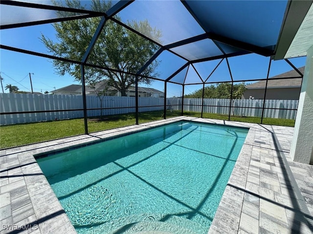 view of swimming pool featuring a fenced in pool, glass enclosure, and a fenced backyard