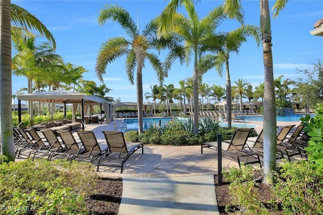 view of patio / terrace featuring a community pool and a gazebo