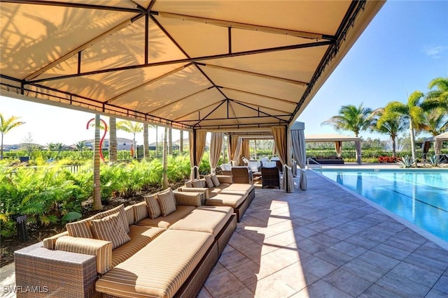 view of pool with a gazebo, an outdoor hangout area, and a patio