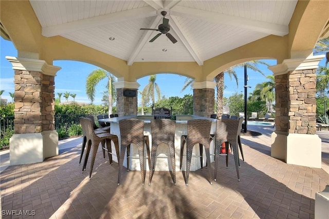 view of patio / terrace with a gazebo, an outdoor bar, and ceiling fan