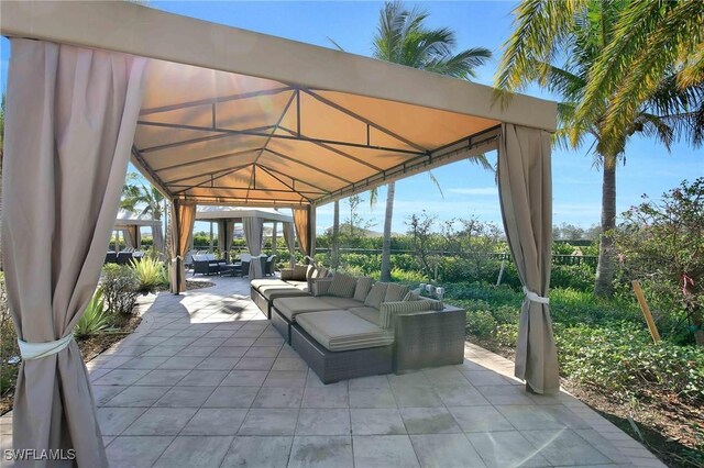 view of patio featuring outdoor lounge area and a gazebo