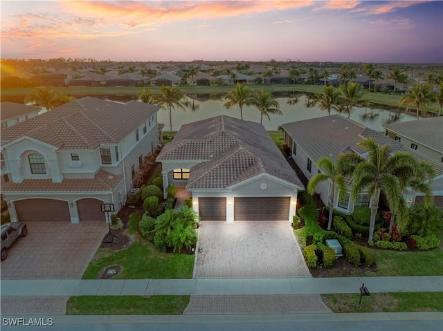 aerial view at dusk with a water view