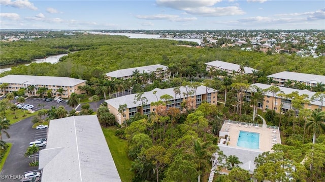 bird's eye view featuring a water view and a forest view