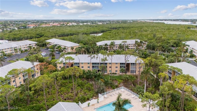 aerial view featuring a water view and a view of trees