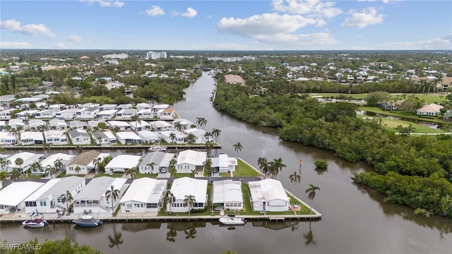 birds eye view of property featuring a residential view and a water view