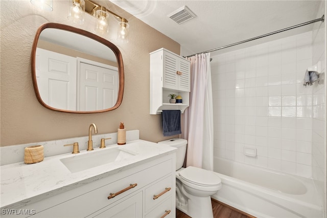 full bathroom with shower / bath combination with curtain, vanity, and toilet