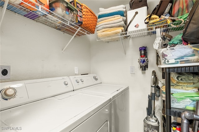 laundry room featuring separate washer and dryer