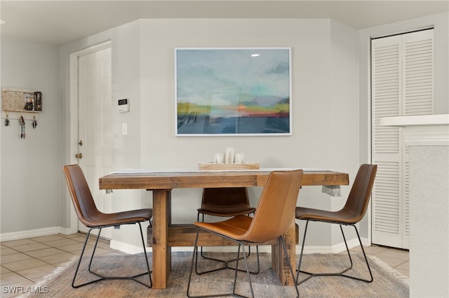 dining space with light tile patterned floors