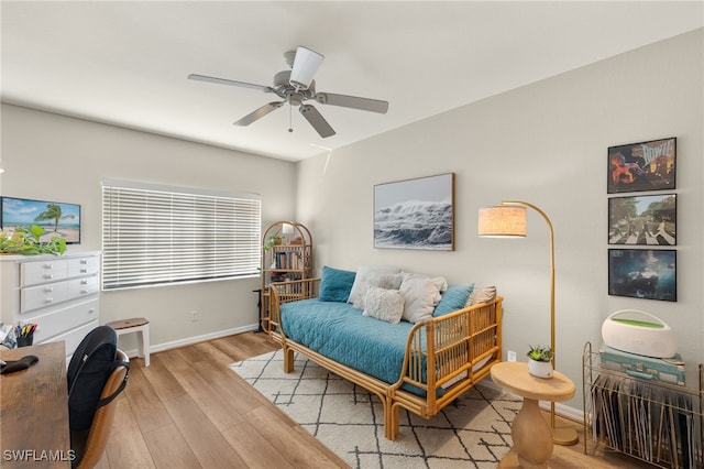 living area featuring ceiling fan and light hardwood / wood-style flooring