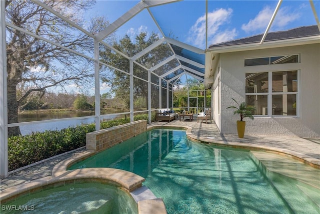 view of swimming pool featuring a patio area, an in ground hot tub, a water view, and glass enclosure