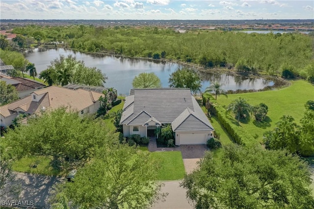 birds eye view of property with a water view