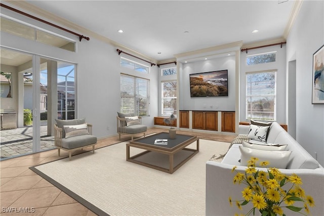 tiled living room featuring ornamental molding, a wealth of natural light, and french doors