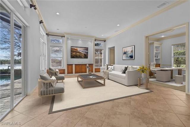 living room featuring ornamental molding and light tile patterned floors