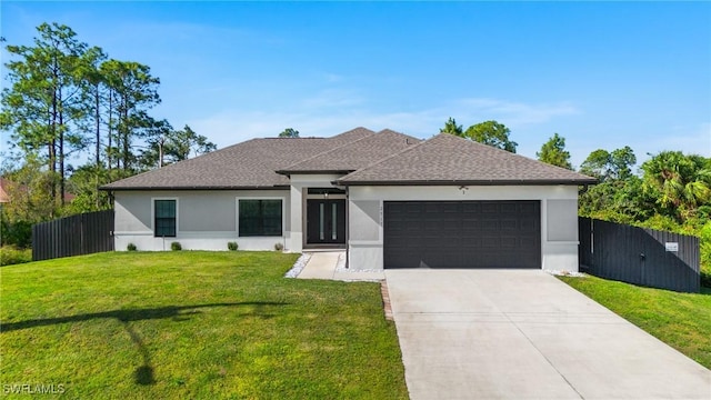 view of front facade featuring a garage and a front lawn